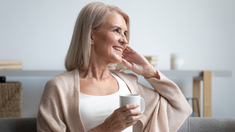 Woman holding coffee cup