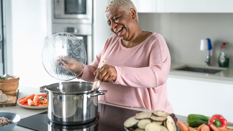 Woman smiling while cooking
