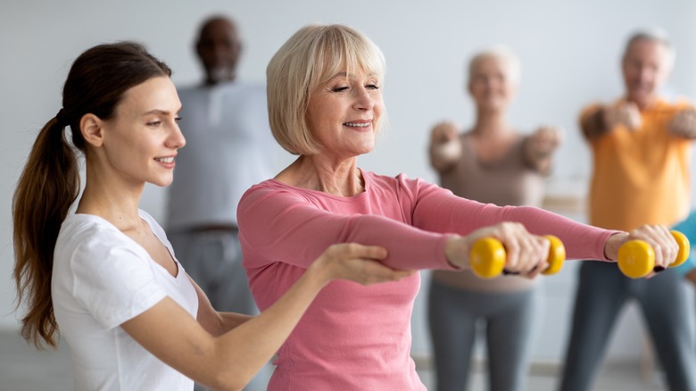 Older woman with dumbbells