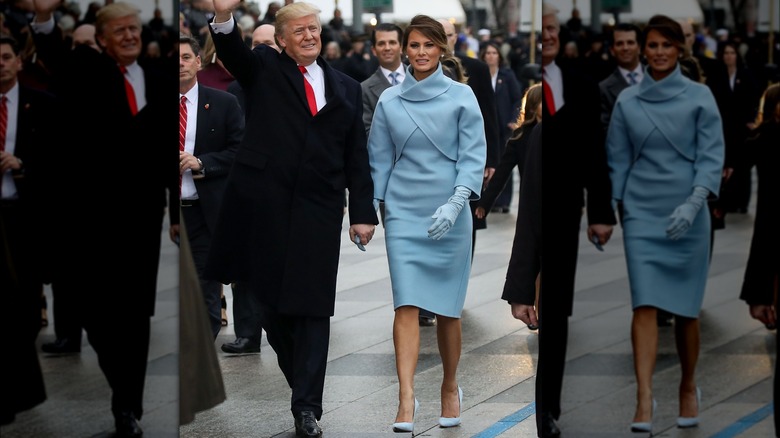 Donald Trump walking with Melania Trump, who wears a powder-blue dress, gloves, and shoes.