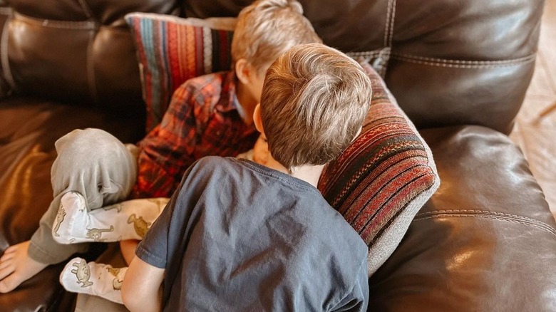 Israel, Samuel, and Freddy Dillard on sofa