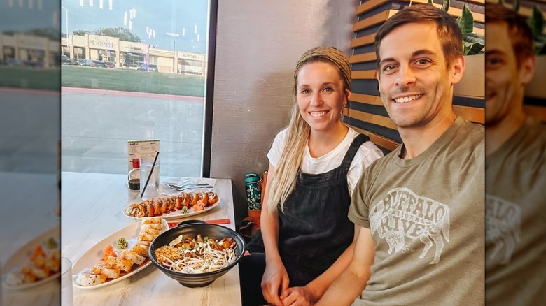 Jill and Derick Dillard smiling at dinner