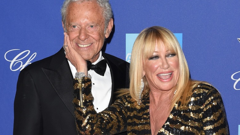 Suzanne Somers touching Alan Hamel's face