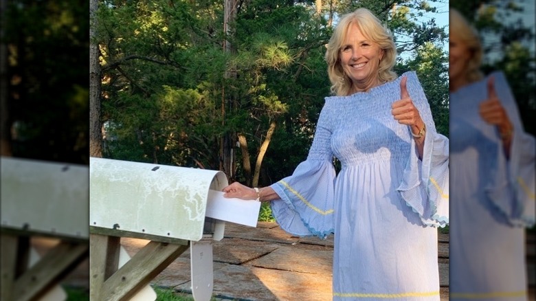 Jill Biden blue dress putting letter in mailbox