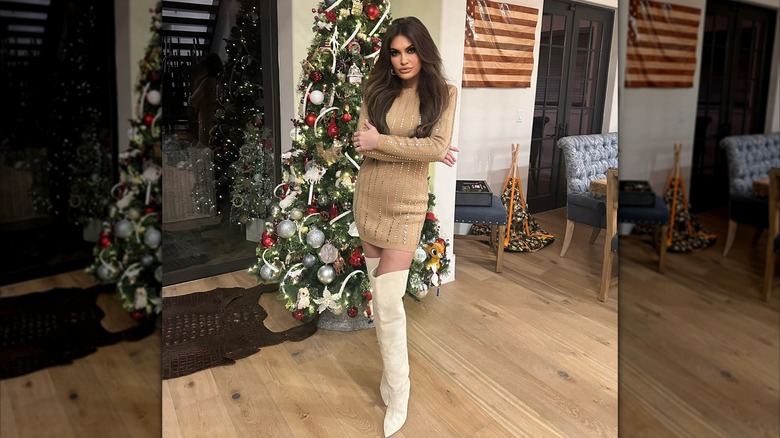 Kimberly Guilfoyle posing by Christmas tree