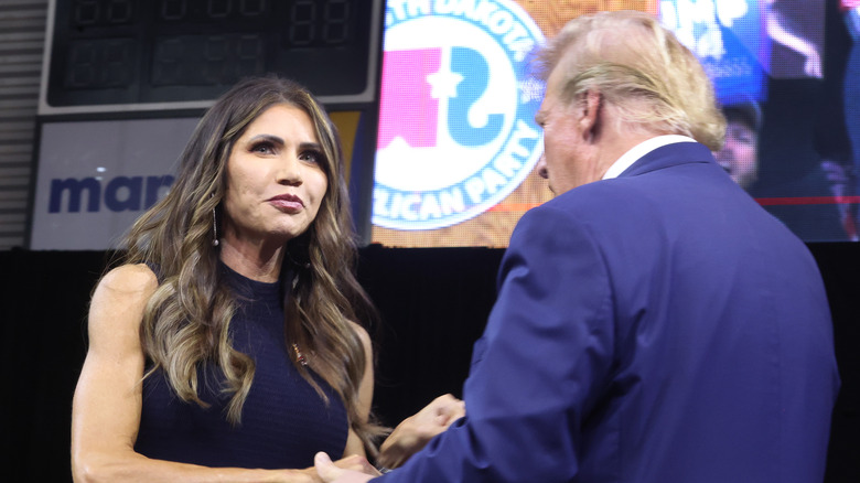 Donald Trump greeting Kristi Noem