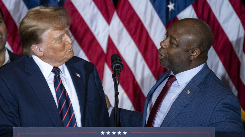 Donald Trump and Tim Scott looking at each other