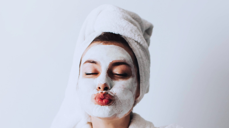 woman with mud mask on her face