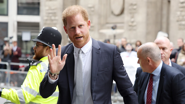 Paparazzi shot of Prince Harry and Chelsy Davy in audience