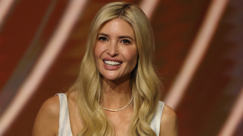 Ivanka Trump smiles in a white dress