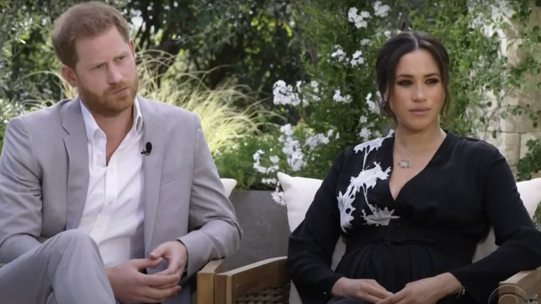 Prince Harry and Meghan Markle sitting together