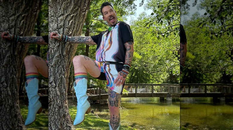 David Bromstad striking a pose and showing off his tattoos