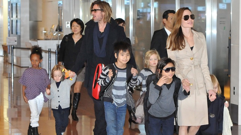 Brad Pitt Angelina Jolie walking with their children