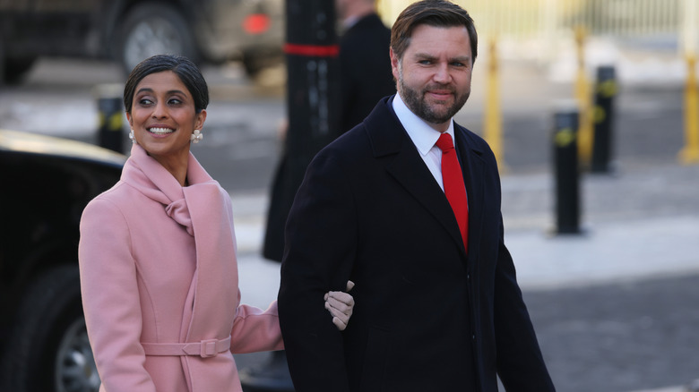 JD Vance and Usha Vance walking arm-in-arm