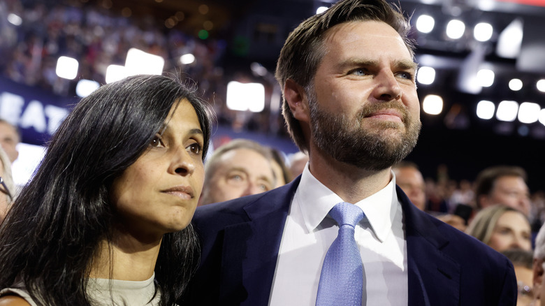 JD Vance smiling with a serious-looking Usha at his side