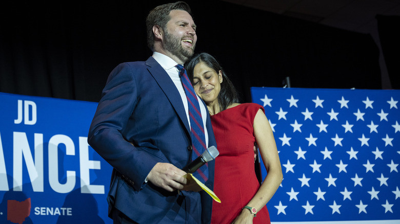 JD Vance and Usha Vance hugging on stage