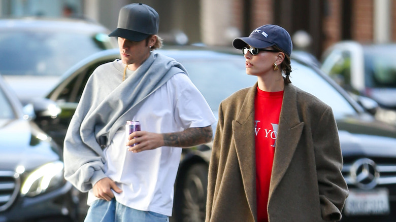 Justin and Hailey Bieber walking down the street