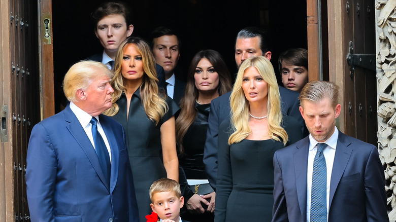 The Trump family standing on stairs