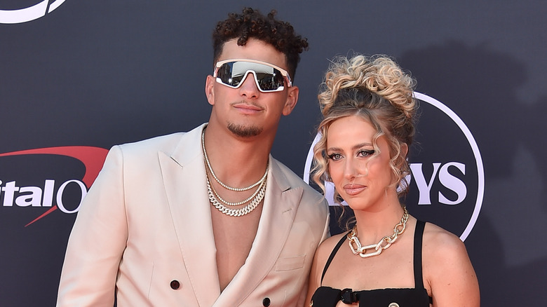 Patrick and Brittany Mahomes posing for the cameras