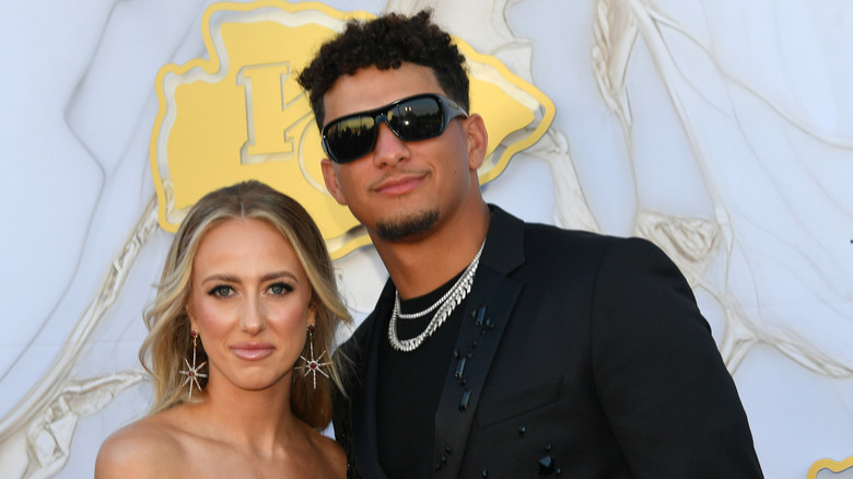 Patrick and Brittany Mahomes posing at a red carpet event