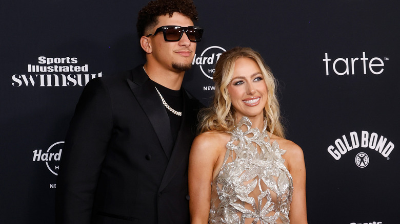 Patrick and Brittany Mahomes beaming at the cameras