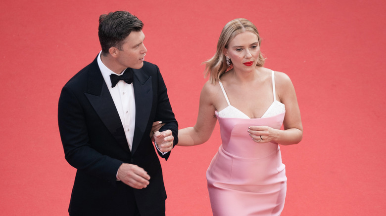 Scarlett Johansson and Colin Jost walking on the red carpet