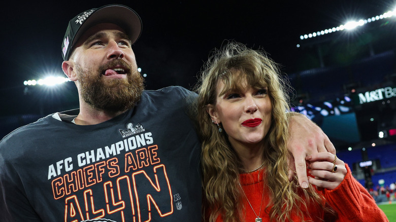 Travis Kelce and Taylor Swift smiling