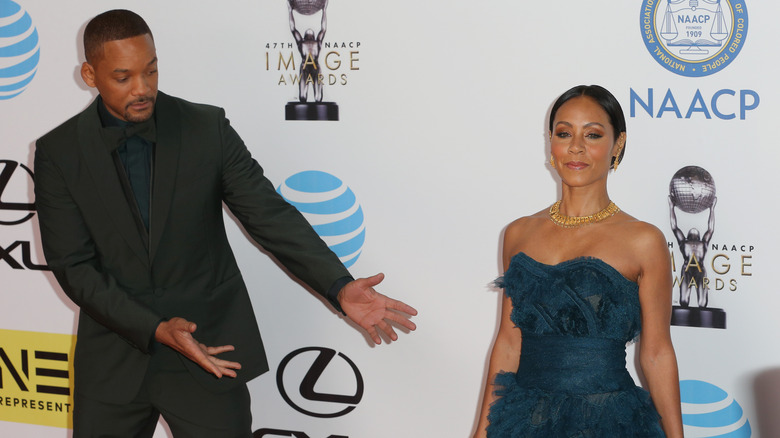 Will Smith gesturing toward Jada Pinkett Smith