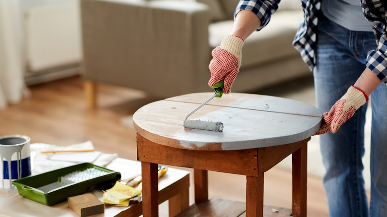 woman painting table