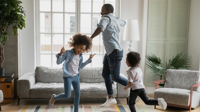 family dancing in living room