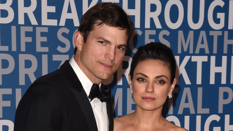 Ashton Kutcher with Mila Kunis on the red carpet