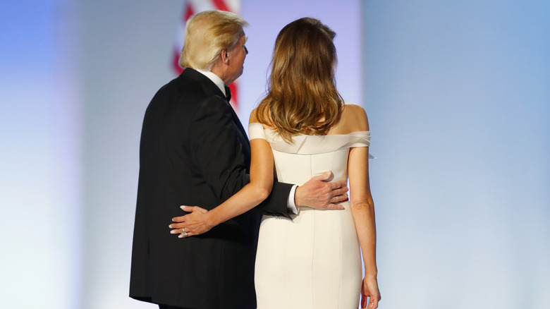 Donald and Melania Trump posing from behind