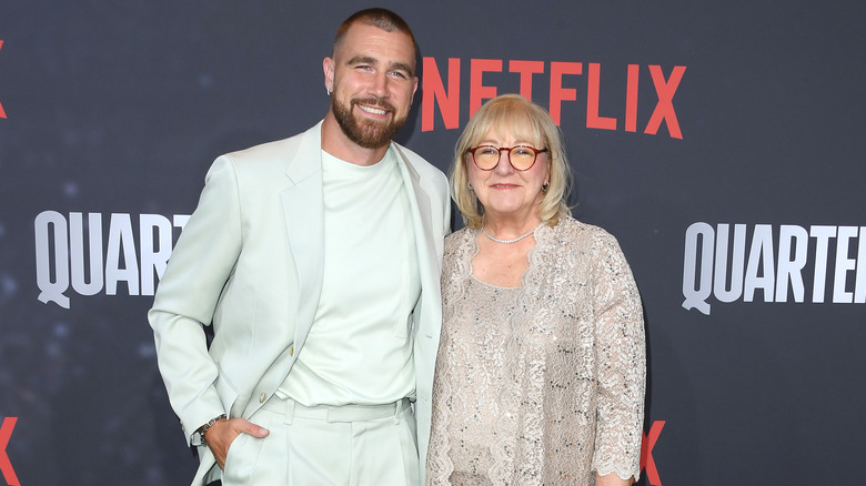 Travis and Donna Kelce posing at a Netflix event