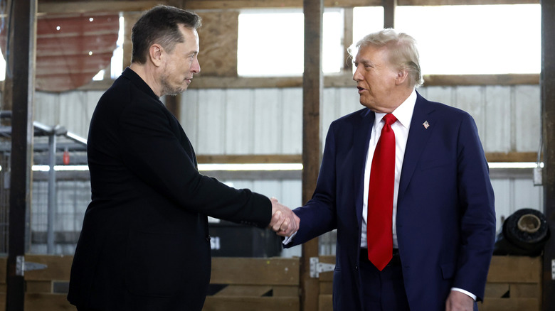 Elon Musk and Donald Trump shaking hands