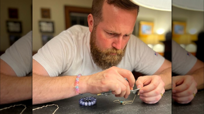 Ben Napier fixing a necklace