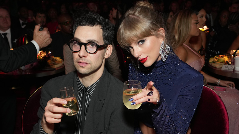 Jack Antonoff and Taylor Swift lifting their glasses