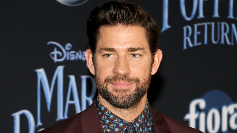 John Krasinski smiling on the red carpet