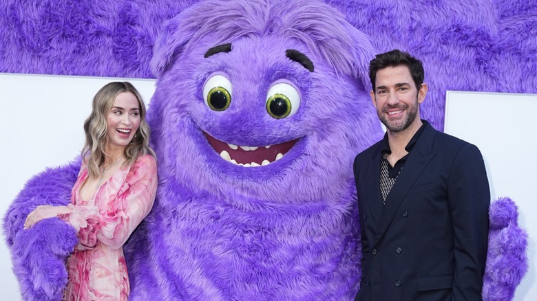 Emily Blunt and John Krasinski being hugged by Blue at the 'IF' premiere