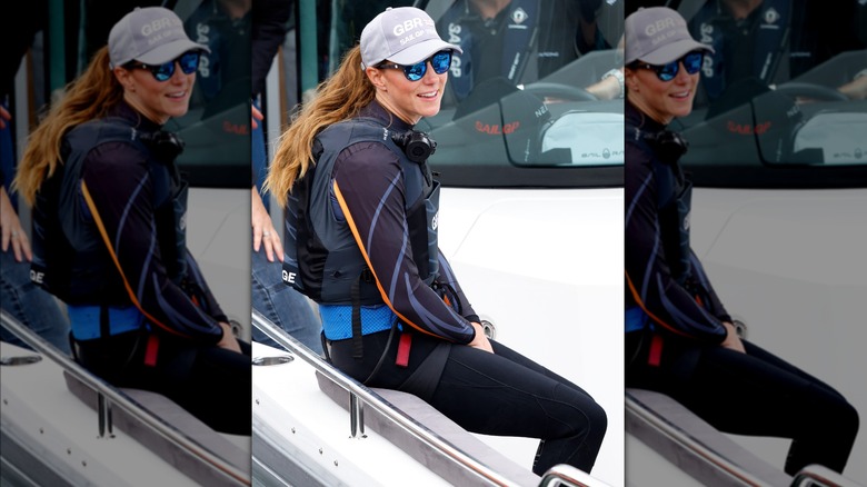 Kate Middleton sitting on boat in sailing gear