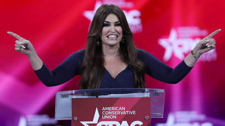 Kimberly Guilfoyle at podium, pointing