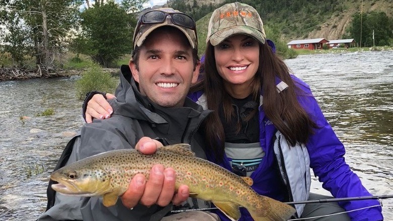 Kimberly Guilfoyle and Donald Trump Jr. posing with a fish