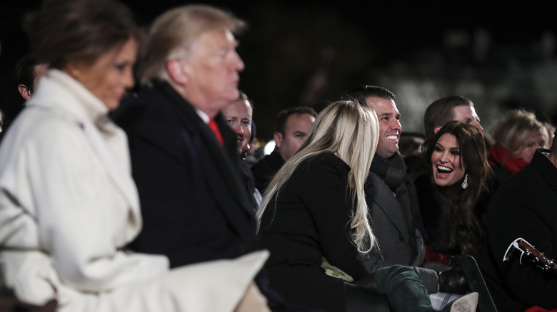 Kimberly Guilfoyle sitting with the Trump family