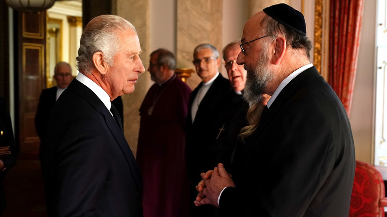 Prince Charles shakes hands with Rabbi Ephraim Mirvis