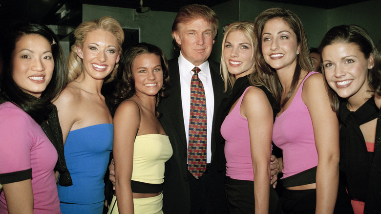 Donald Trump posing with women