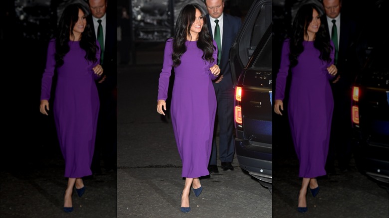 Meghan Markle arriving at Royal Albert Hall in purple dress in 2019