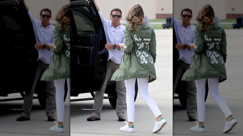 Melania Trump getting into a car wearing a jacket that says "I really don't care do u?"