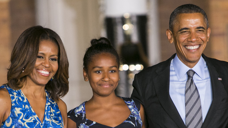 Michelle and Barack Obama with daughter Sasha 