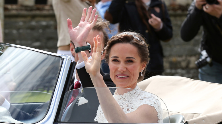 Pippa Middleton smiles in car at her wedding