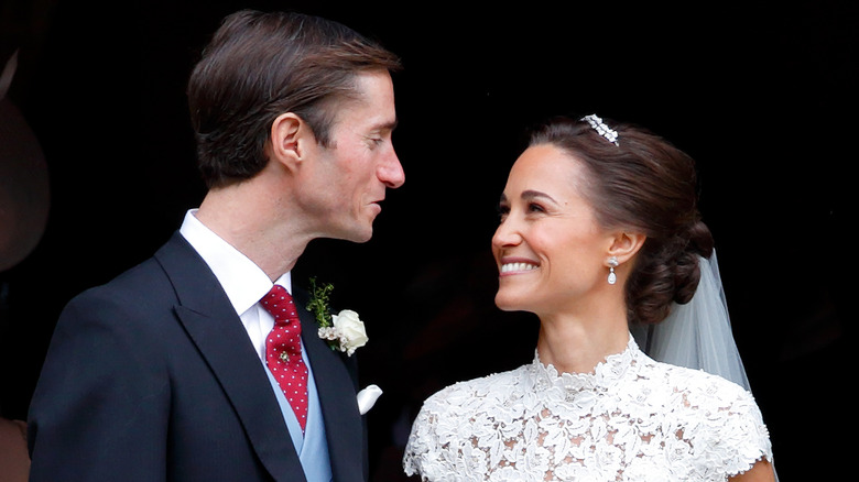 Pippa Middleton and James Matthews smiling at each other