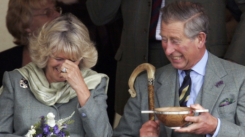 Prince Charles and his wife Camilla, Duchess of Cornwall, share a laugh at the 2005 Mey Games at Queens Park in Mey in Caithness, Scotland (2006)